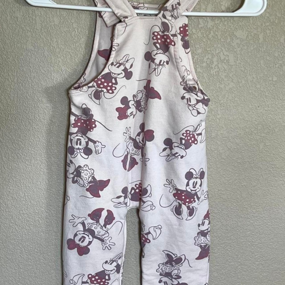 Disney Baby Minnie Mouse overalls with repeating Minnie Mouse graphics